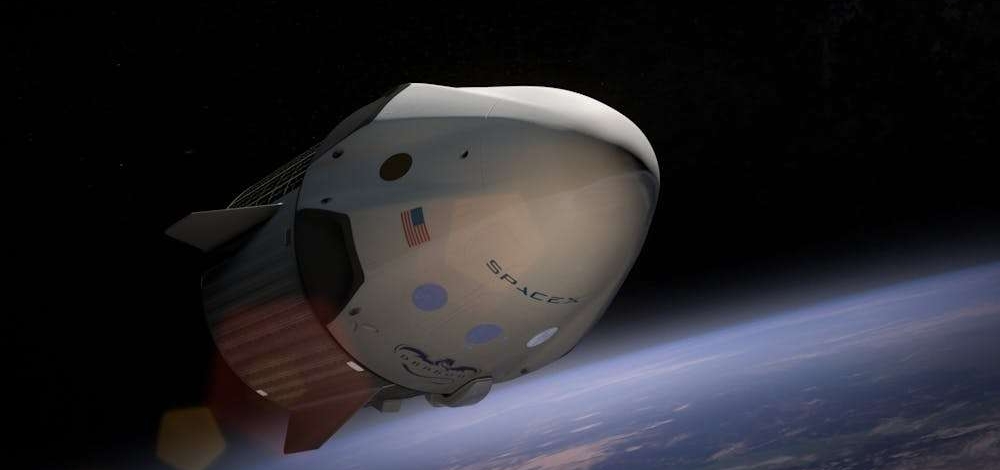 A SpaceX Dragon spacecraft orbiting Earth, captured in vivid detail against space.